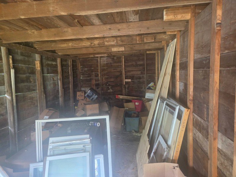 Garage cleanout help in Charlotte NC with unwanted boxes tools shelves and garage clutter